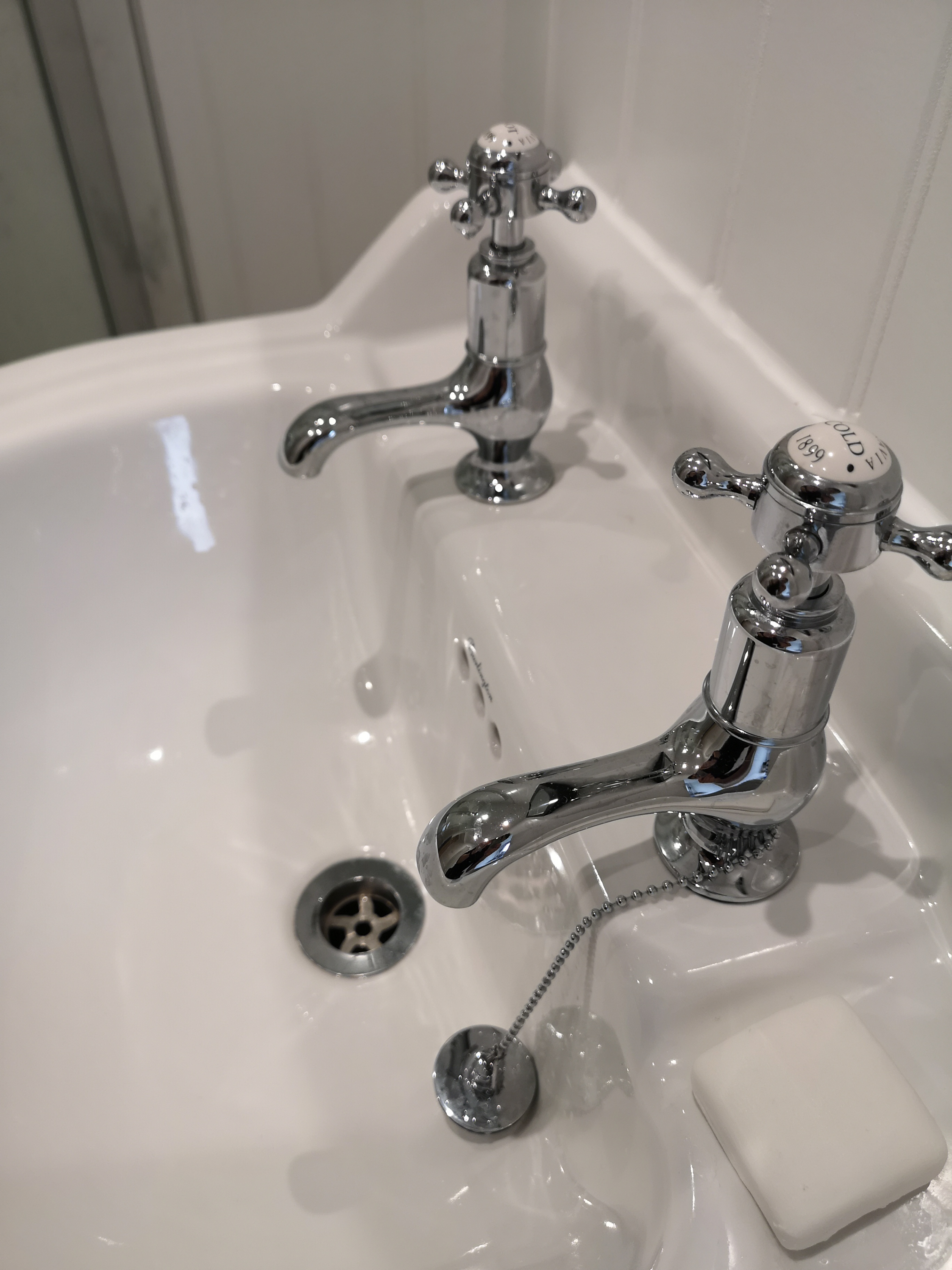 Traditional Bathroom Sink with separate hot and cold taps.
