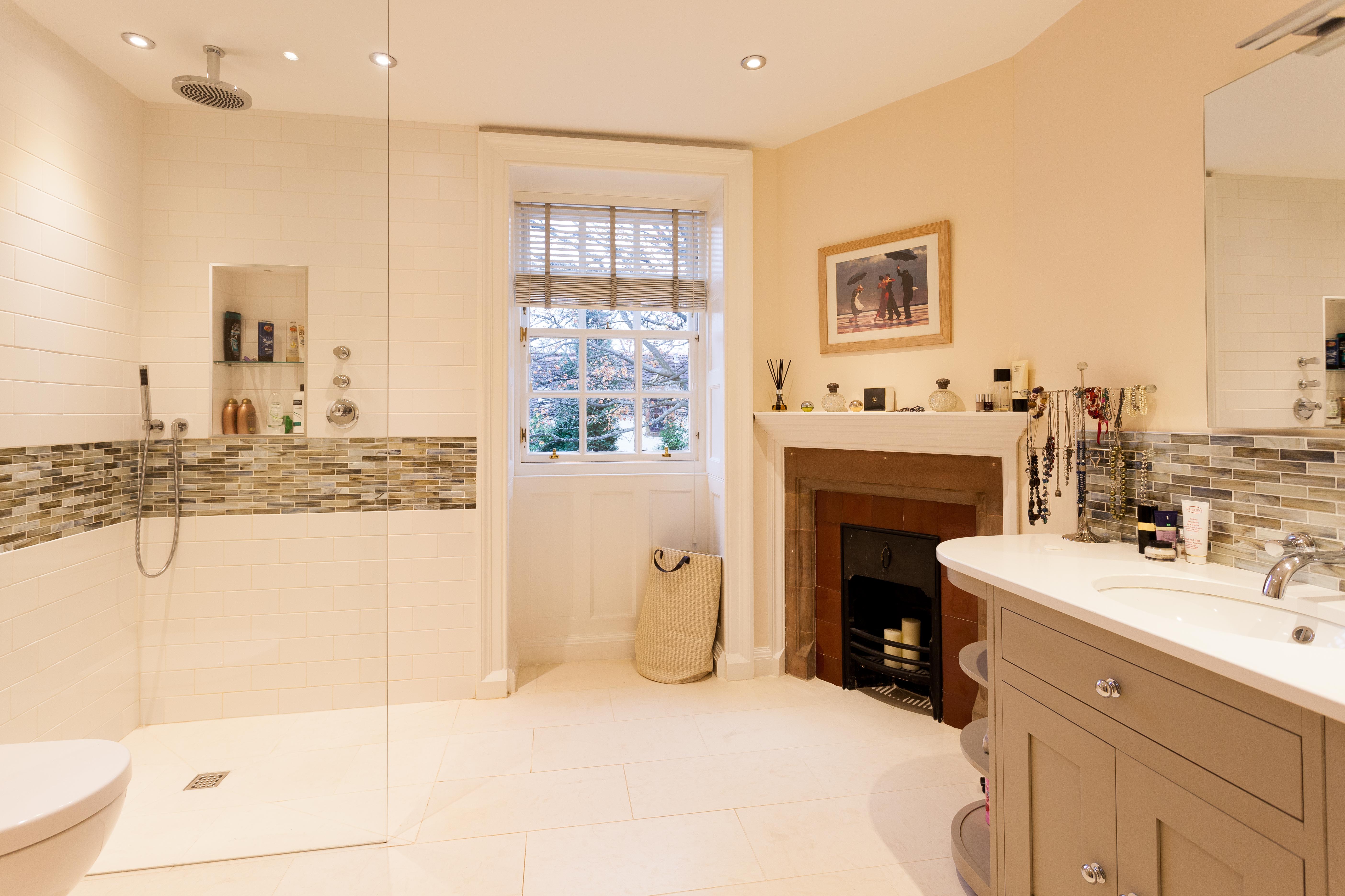 Large traditional bathroom with open fireplace